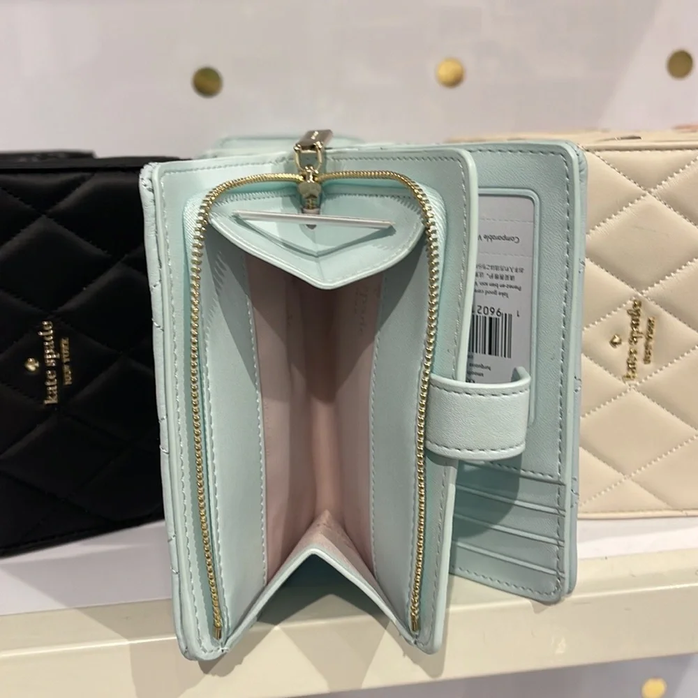 Kate Spade Carey Medium Compartment Bifold Wallet 
COLOR: Turquoise - Picture 10 of 16